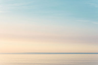Scenic view of sea against sky at sunset