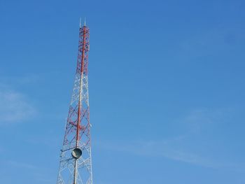 Low angle view of communications tower against sky