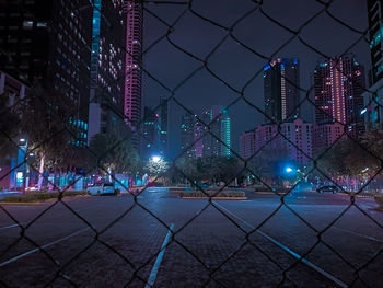 Illuminated modern buildings in city at night