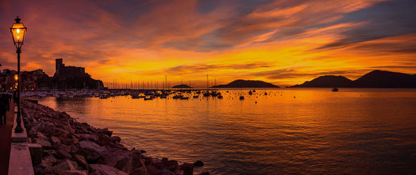 Scenic view of sea against orange sky