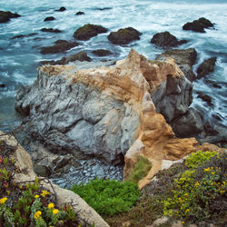 High angle view of rocks at sea shore