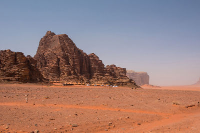 Rock formations in desert against clear sky