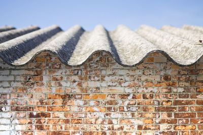 Low angle view of brick wall