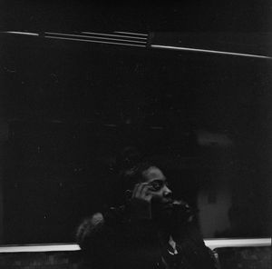 Portrait of man photographing at night