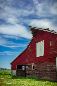 House on field against sky