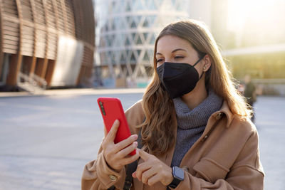 Young woman using mobile phone