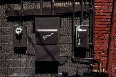 Close-up of meter boxes on wall