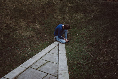 Solitary teenage boy outdoors