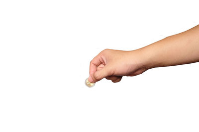 Close-up of hand holding hands over white background