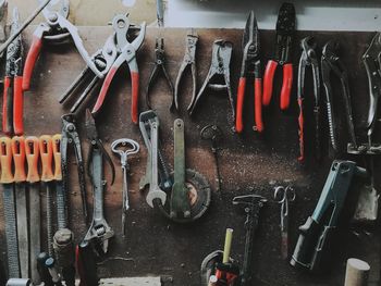 Directly above shot of various tools arranged on table at workshop