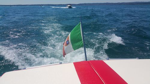 Close-up of flag over sea