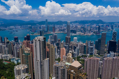 Aerial view of city and buildings against sky