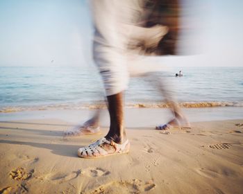 Low section of person on beach