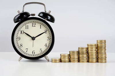 Close-up of clock tower against white background