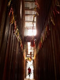 Full length of man walking in decorated corridor