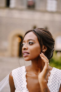 Portrait of a young woman looking away