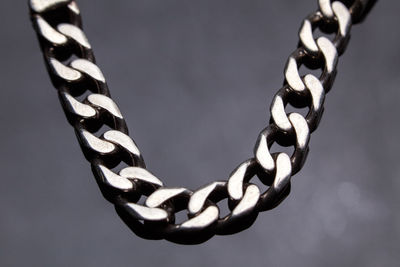 Close-up of chain against black background