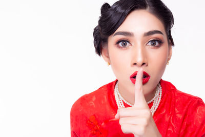 Portrait of a beautiful young woman over white background