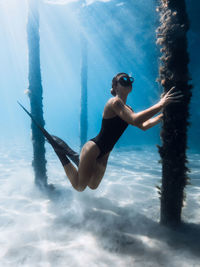 Young woman swimming in sea