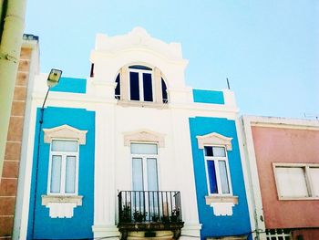 Low angle view of built structure against blue sky