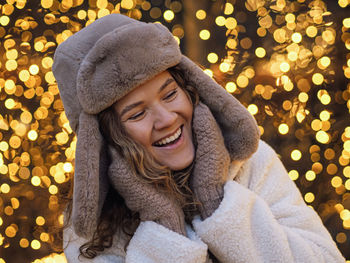 Portrait of young woman wearing warm clothing