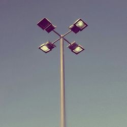 Low angle view of pole against blue sky