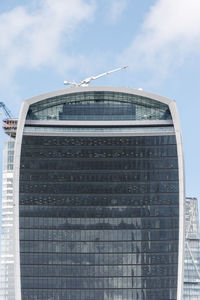 Low angle view of modern building against sky