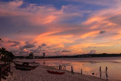 Scenic view of beach against sky during sunset