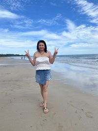 Full length of man standing on beach