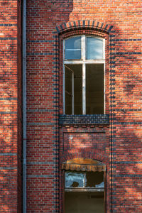 Old house facade with broken windows