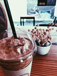 Close-up of ice cream in glass on table