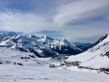 Scenic view of snowcapped mountains against sky