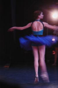 Midsection of woman dancing at nightclub