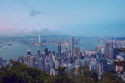 High angle view of modern buildings in city against sky