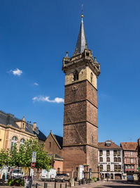 Low angle view of clock tower against sky