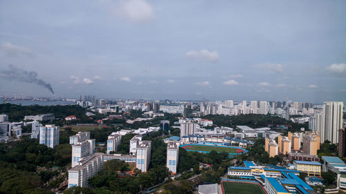 Aerial view of cityscape against sky