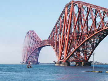 Bridge over sea against sky