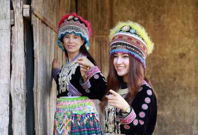 Portrait of a smiling young woman wearing hat