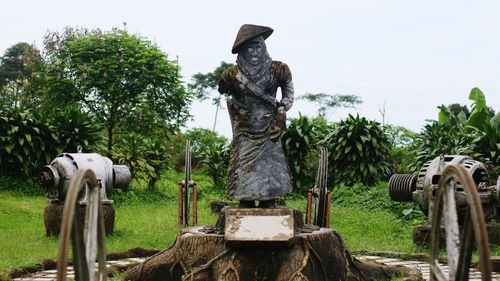 Statue in park against clear sky