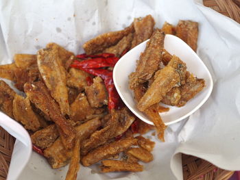 High angle view of fried fish in basket