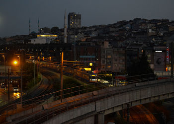 High angle view of illuminated buildings in city at night