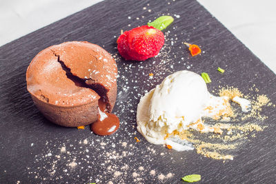 Molten chocolate cake with ice cream served in plate