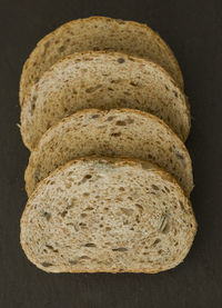 High angle view of bread on table against black background