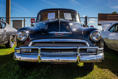 Old vintage car against blue sky