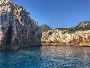 Scenic view of sea against clear blue sky