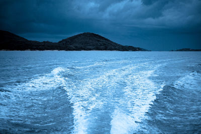 Scenic view of sea against cloudy sky