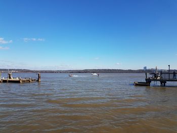 Scenic view of sea against blue sky