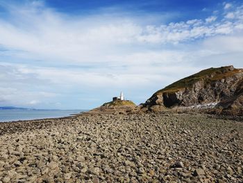 Scenic view of beach against sky