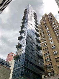 Low angle view of modern buildings against sky