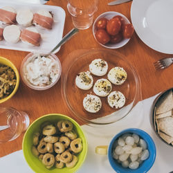 View from the top of table with many foods ready for aperitif with family and friends dinner at home